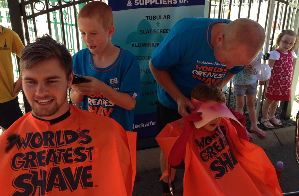 Cooper shaves other brave participants' hair. Picture: CONTRIBUTED