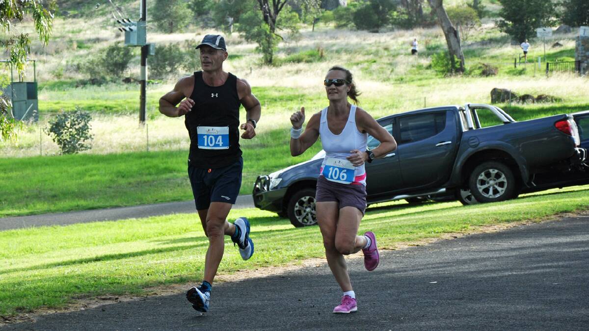 Two brave competitors in the half-marathon reach the halfway mark.