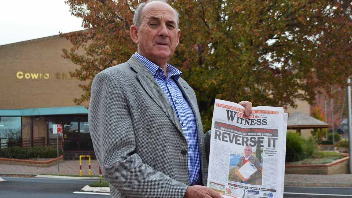 Cowra mayor Cr Bill West with a copy of the Young Witness, which mobilised the public to protest against the decision by the NSW State Government to install a satellite renal unit in Cowra, not Young.