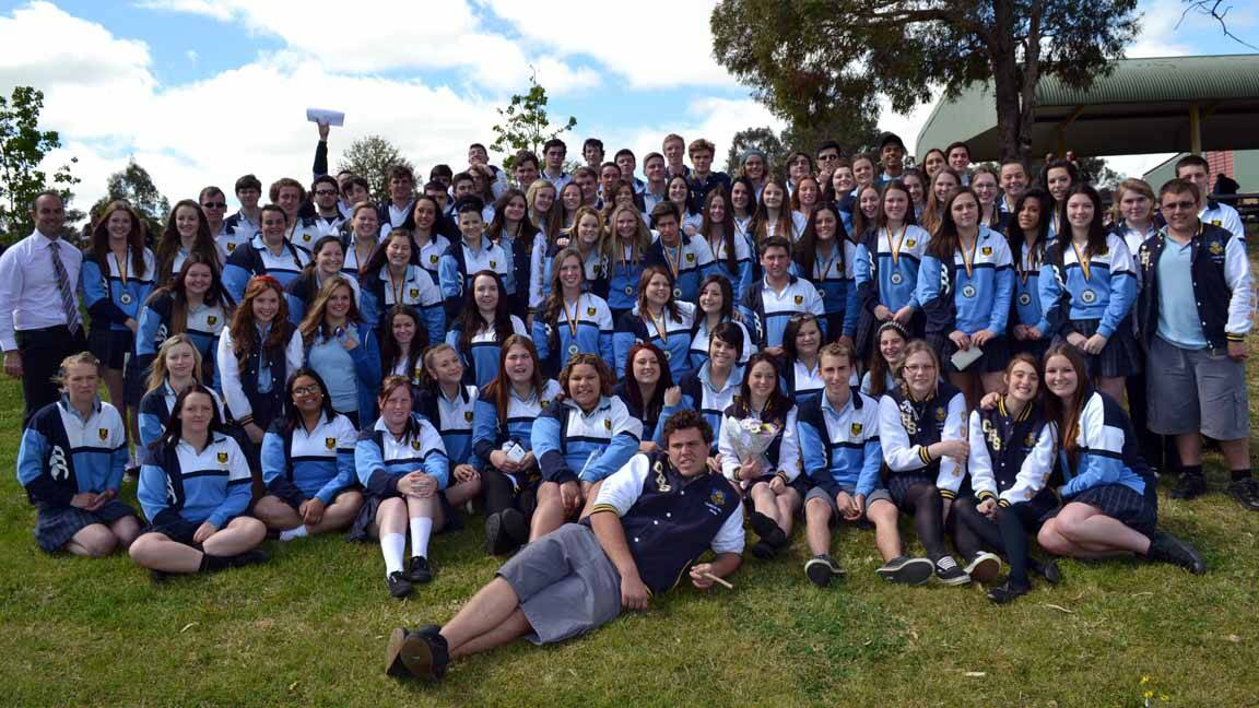 The outgoing year 12 students and year coordinator Scott Carpenter after the final assembly.