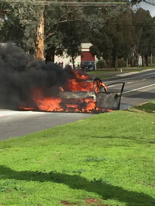 The car on fire on the Young Road.