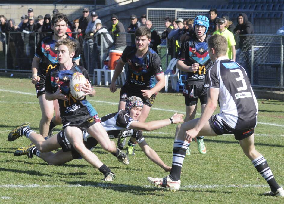 OUTPLAYED: Brayden Bennett finds space for the Bathurst Panthers under 18s in their 40-18 defeat to the Cowra Magpies on Sunday at Carrington Park. Photo: CHRIS SEABROOK 	062815cu18s1