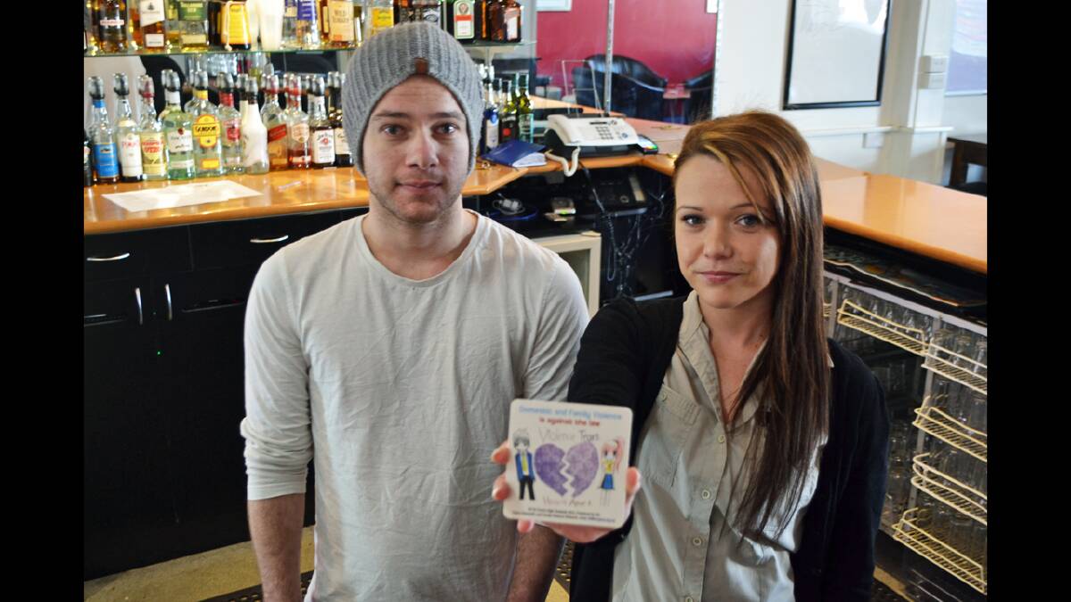 Displaying coasters already in use, Imperial Hotel staff Brendan Bernays and Jacinta Gordon get behind the cause which will soon see new coasters distributed to local pubs and clubs. 