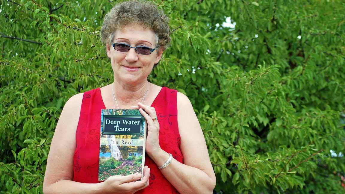 Former Cowra local Jan Reid with her book 'Deep Water Tears'.