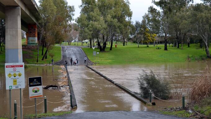 Cowra's low level bridge being inundated with rising Lachlan River levels last week.