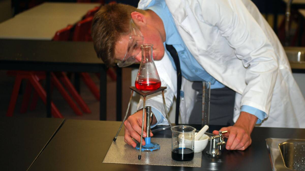 Brody Hannan runs a science experiment.