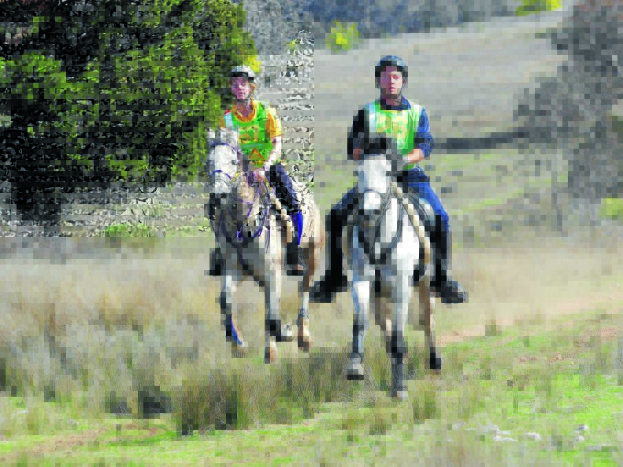 Gallop finish: Ben Hudson from Mudgee and Talea Hasko-Stewart of Canberra head for home in the inaugural Bumbaldry Endurance Ride. Ben won the ride very narrowly over Talea taking exactly 5 hours for the 80 kilometre journey. Photo: Animalfocus Photography.