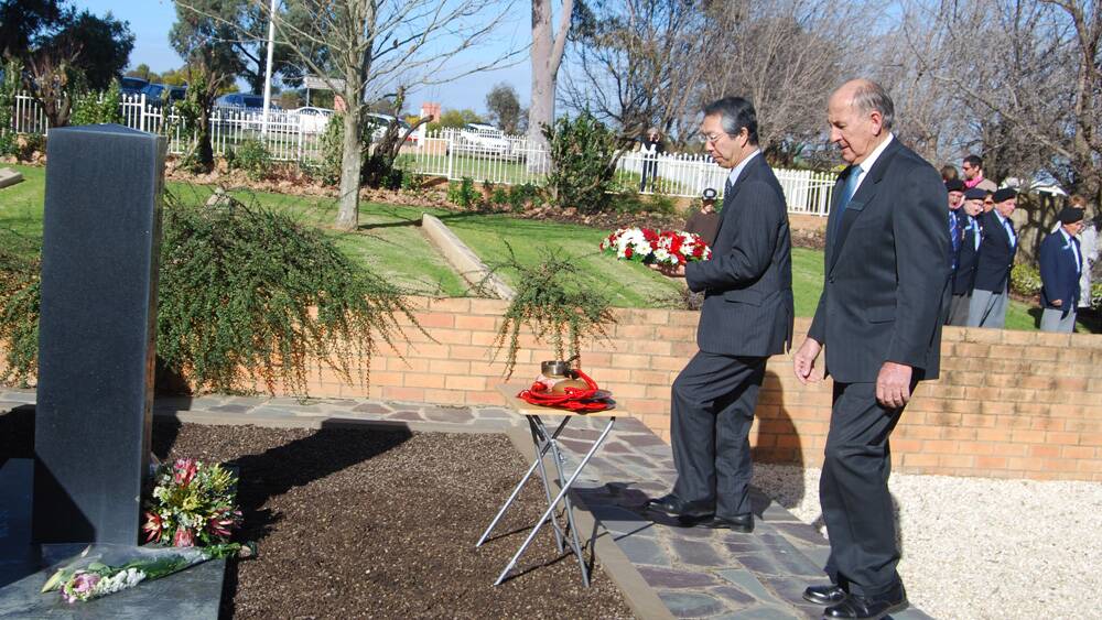 Japanese Ambassador Yoshitaka Akimoto and Cowra mayor Bill West lay a wreath at the Japanese War Cemetery.
