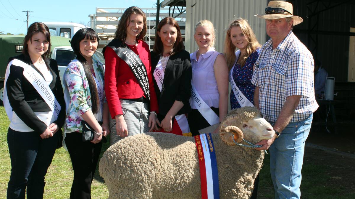 Cowra Showgirls pictured with Grand Champion Merino in show, pictured with owner Kim Whitechurch of 'Wendouree,' Grenfell.