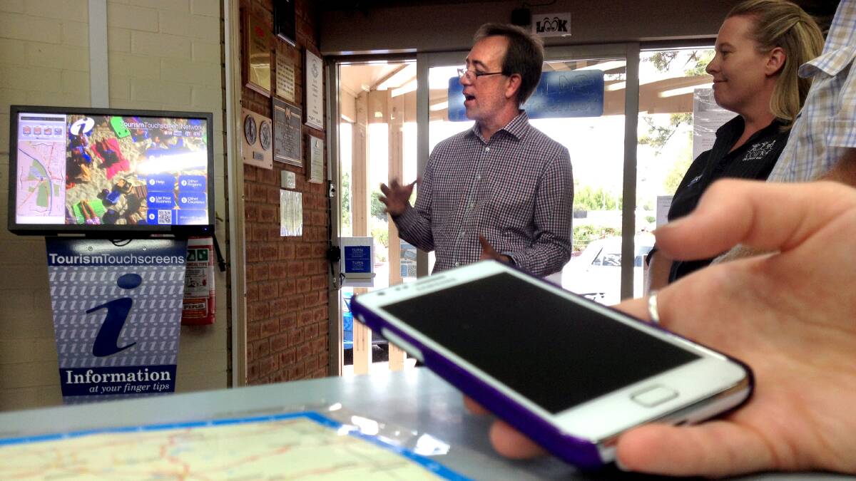 Datatrax CEO Paul Buckley discussing the Take You There App and new touchscreen at the Cowra Visitor Information Centre.