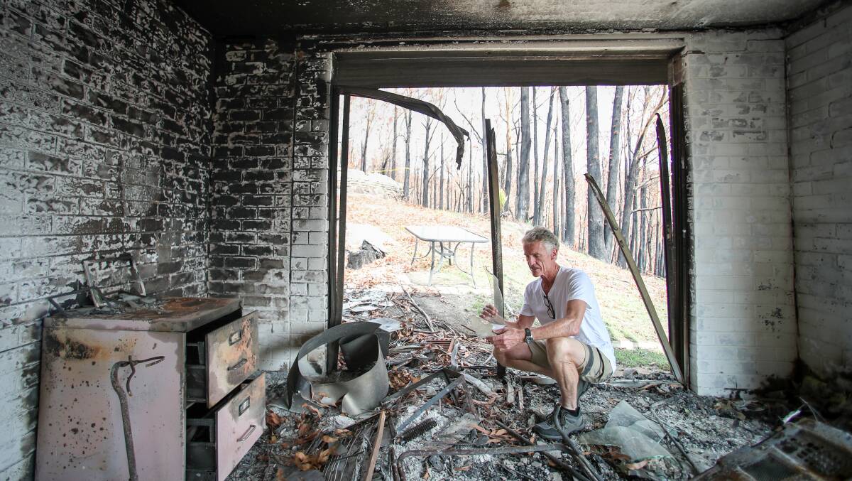 Greg Webb at the remains of his home in Lake Conjola on the NSW south coast in February 2020 after the Black Summer bushfires. Picture by Adam McLean
