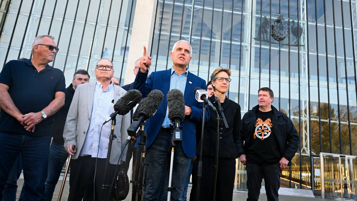 TWU National Secretary Michael Kaine speaks to the media after leaving the High Court. (AAP Image/Lukas Coch)