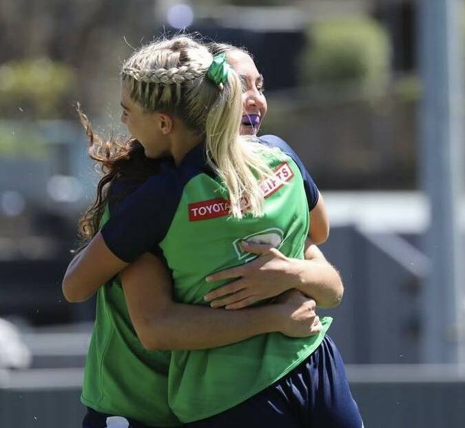 Jade Harding celebrating with a team mate at the Canberra Raiders