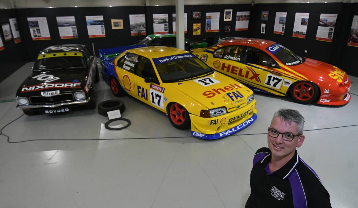 CARS: National Motor Racing Museum coordinator Brad Owen, with some of the cars from the Dick Johnson exhibition. Photo: CHRIS SEABROOK 