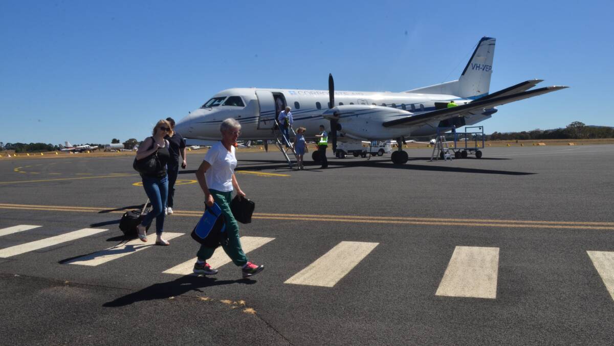 TOUCH DOWN: Passengers disembark from Fly Corporate's first flight from Brisbane to Orange on Monday morning. Photo: DAVID FITZSIMONS