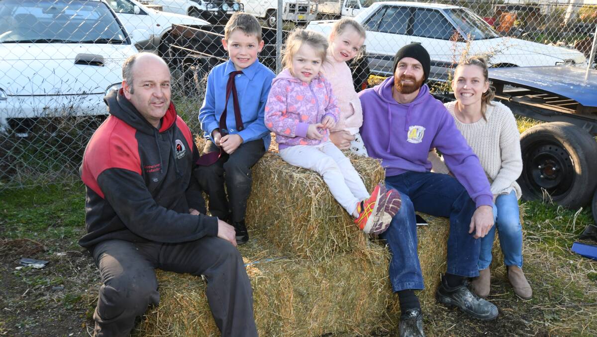 HAY RIDE: Darren Barrett with Wade, Myla, Phoebe and Mitch Kennewell and Shian Duboc as Feed4Farmers prepares for the hay run to Victoria. Photo: JUDE KEOGH 0809jkhay1