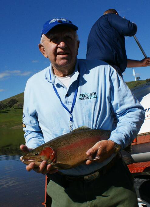 Tom Williams with a trout at Carcoar Dam.