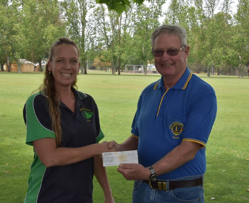 Tina Walker (President of the LERC) presents a cheque to the Cowra Lions' David Thomas, who representing the Lions' National Drought Appeal.