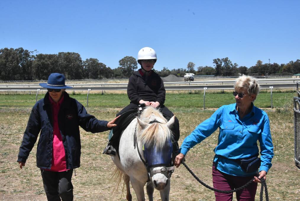 A young riding enthusiast enjoys the RDA's end-of-year Open Day, held last Wednesday. Photo: Ben Rodin