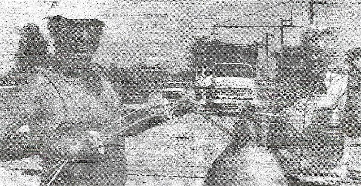 Cowra Harness Racing Club president Gordon Baxter (left), dismantling the racing lights at the Showgrounds prior to a return to day and twilight meets in 1994.