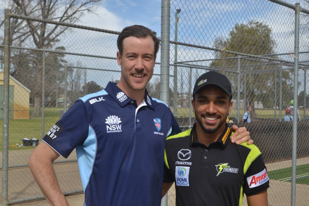 Charlie Stobo and Arjun Nair have both enjoyed their whirlwind visit to the Central West to interact with junior cricketers. Photo: Ben Rodin