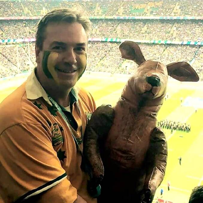 David Harrison was an allround sportsman and played rugby in his school days. He's pictured here backing the Wallabies at a World Cup.