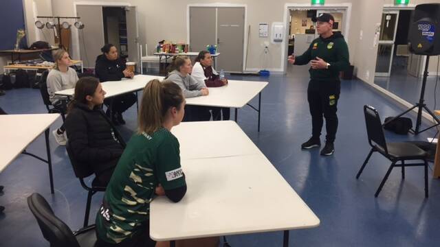 EDUCATION: Brad Donald (right) takes members of the WWRL academy through some key components of women's rugby league. Photo: CONTRIBUTED 