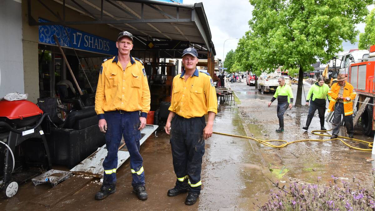Ian Sutherland, Spencer Hawkins in Molong during the clean-up. Picture by Carla Freedman.