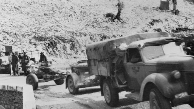 EXIT ALLIES: An Australian Army Ford four-wheel-drive artillery tractor tows a No 27 Mk I limber and an 18 pounder Mk IV in Greece, circa April 1941. Photo: AUSTRALIAN WAR MEMORIAL