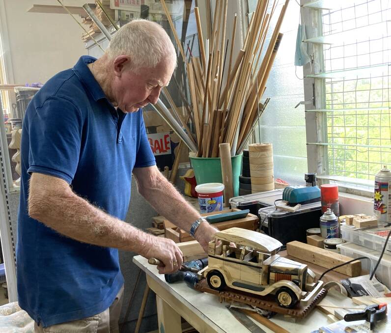 John Sharp working on a wooden car at the Cowra Men's Shed this week. Photo Andrew Fisher