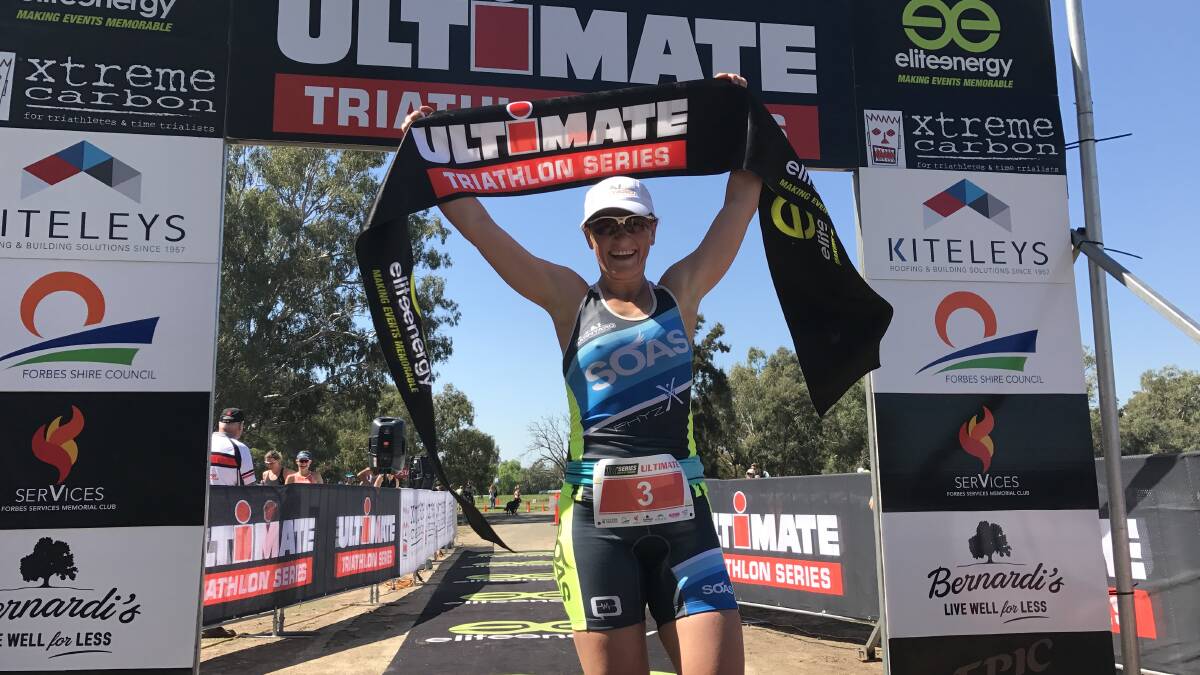 Orange triathlete Jess Richards celebrates her win in the Elite Energy race which was held in Forbes last year. The Forbes club will hold a series of races on December 9.