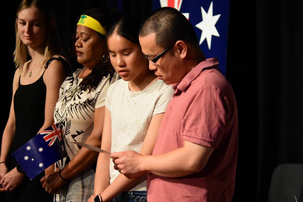 Lucy and Jie Zhang (right) pledging their allegiance. Also pictured are Julie Moore and Lisa Boland who also became Australian citizens.