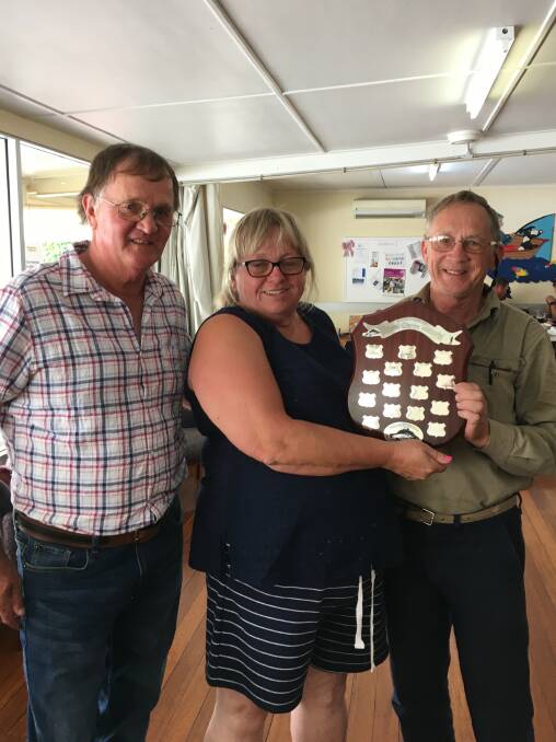 Keith Martin (right) receives the Biggest Fish (men) trophy at the Michael Clarke Memorial from Donald and Norma Clarke.