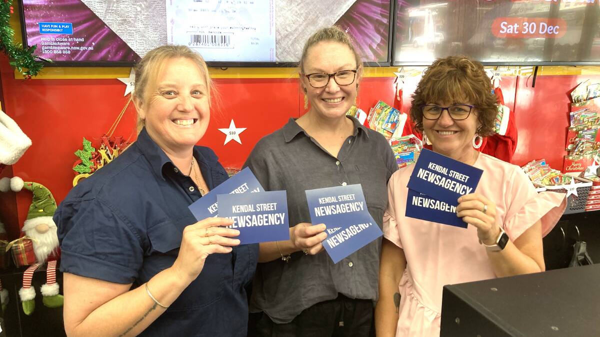 Cowra Newsagency owner Christine Muddle (centre) and staff Kel Higgins and Sharlene Ryan with some of the vouchers in the Club Cowra promotion.