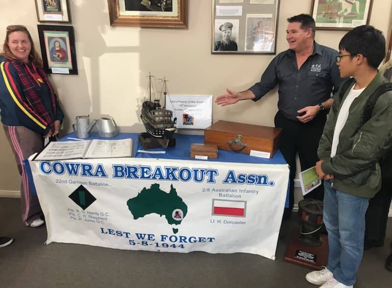 Information Officer, Jason Stephensen sharing information with visitors about the items on display.