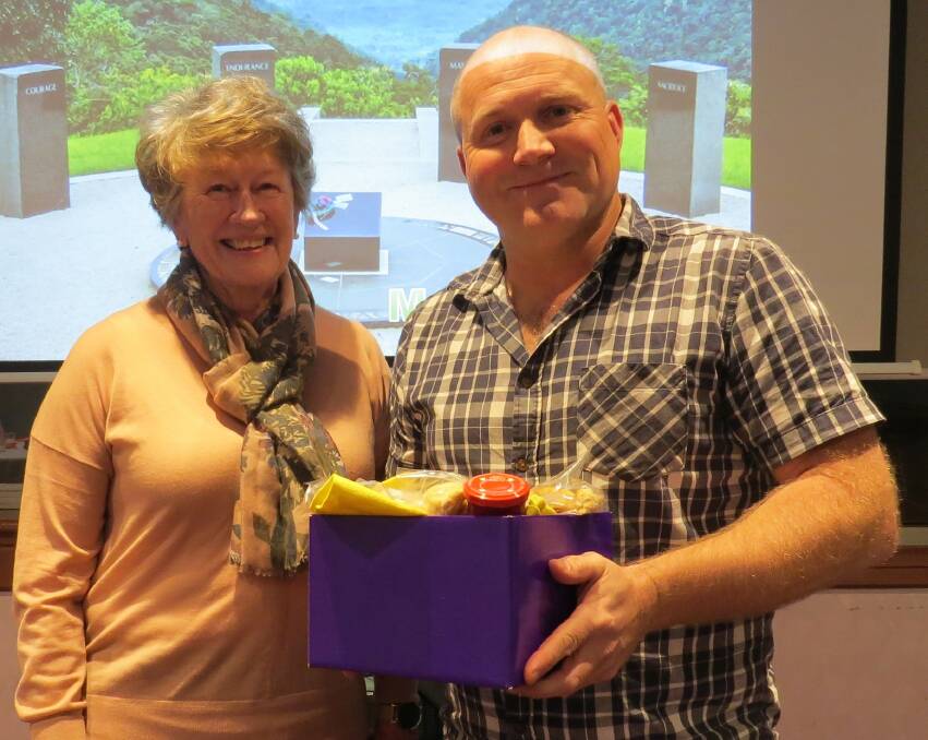 Rowena Casey presenting a gift to guest speaker Marc McLeish.