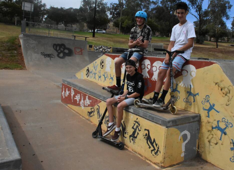 Campbell White, Blake Thomas and Jordy Willing beside some of the current skate park murals.