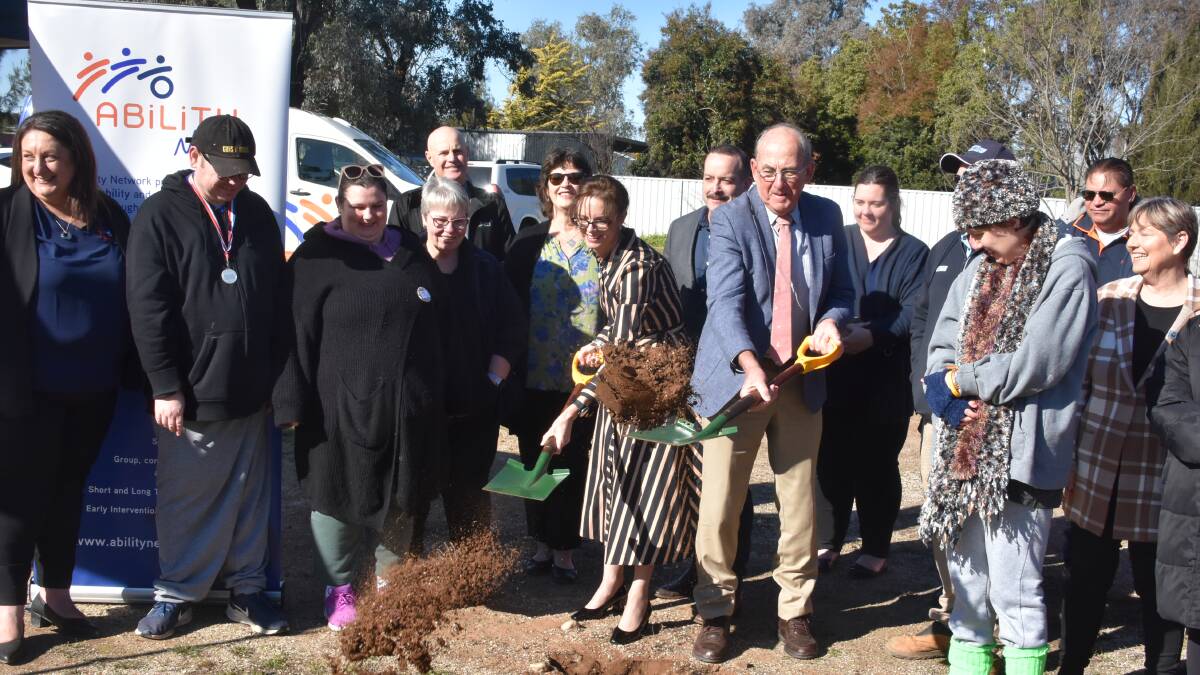 Member for Cootamundra Steph Cooke and former mayor Bill West turning the sod at the site for the Lyall Street facility.
