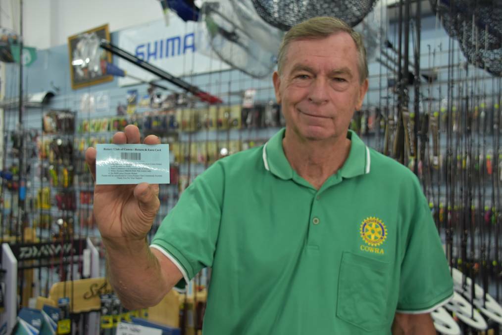 Cowra Rotary member Bob Griffiths with one of the cards Cowra residents can use to donate to the club through Return and Earn.