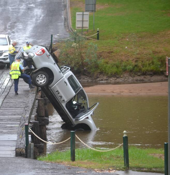 Another car in the river crossing the low level bridge