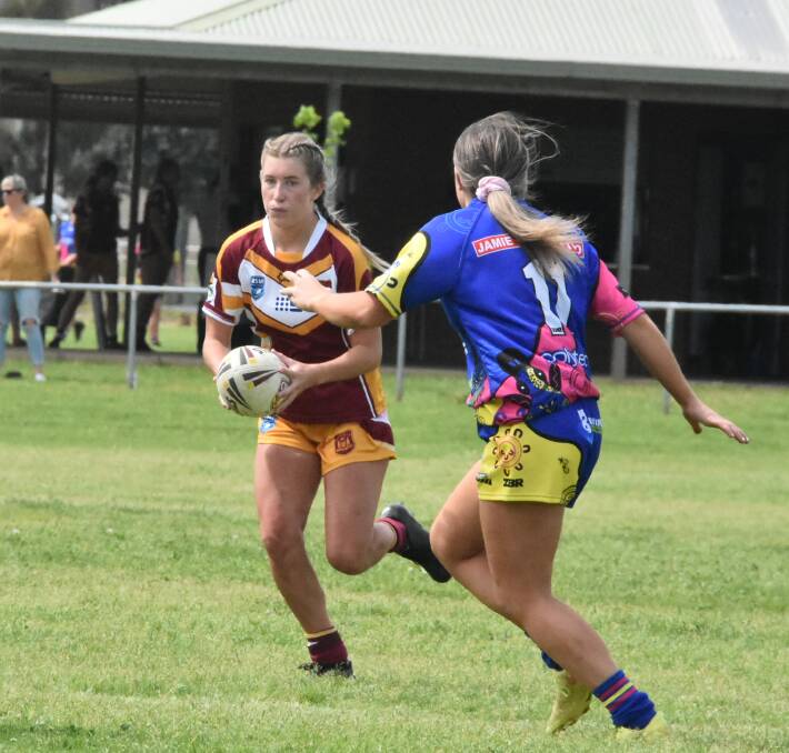 Cowra's Chelsea Apps playing in the Western Women's Rugby League competition last year. The competition has been postponed. 