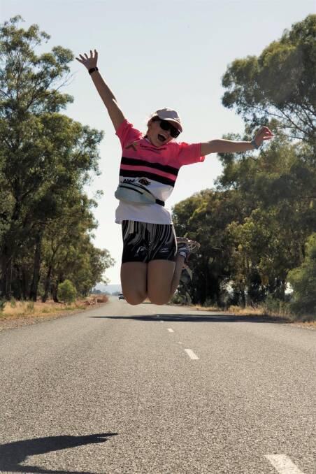 A participant jumps for joy in a previous Cargo to Grenfell Walk. This year's walk has been shortened to Gooloogong to Grenfell.
