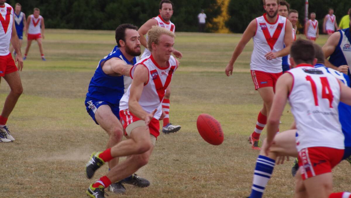 Former Cowra Blues player Simon Treloar contests the ball during a game for Goulburn against ANU.