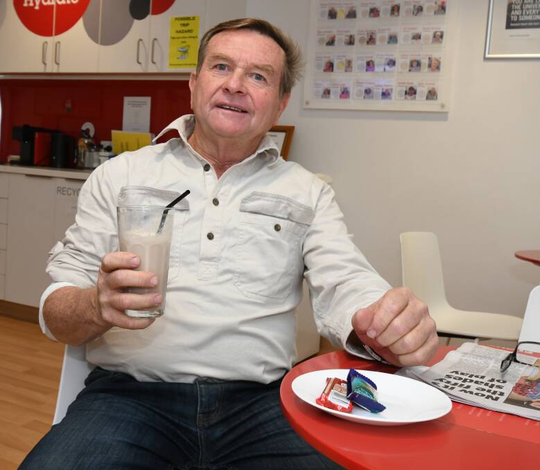 WELL EARNED: Jim Griffiths enjoys one of the post visit-to-the-donor-chair perks at the blood bank.
