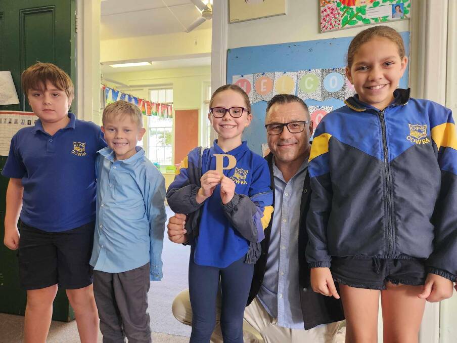 Xander Waqavisi, Charlie Doyle, Olivia Cummins and Kataleena Lee from Stage 2 Gadi class received their first letter "P" from deputy principal Mr Murray.