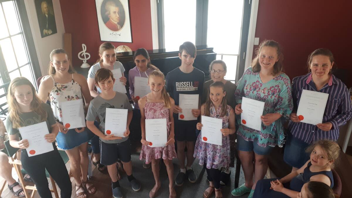 Esther McCarthy's piano students with their awards. See below for names.