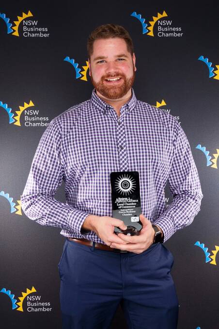 Cowra Business Chamber president Jordan Core with the Chamber's award.