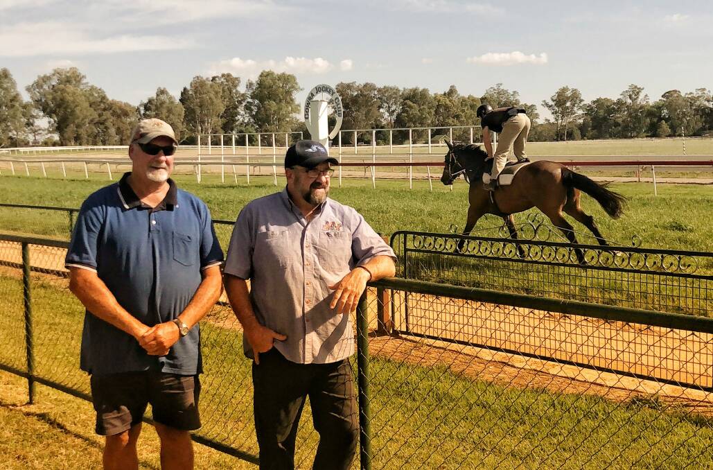 Track Manager Barry Wall and Cowra Jockey Club President Peter Ford hope forecast rain holds off until after Saturday's race meeting.