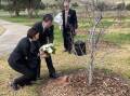 Mrs Kaoru Yamagami and Ambassador Mr Shingo Yamgami placing a bouquet of flowers at the tree planted in 2014 for the late Prime Minister of Japan Mr Shizo Abe.