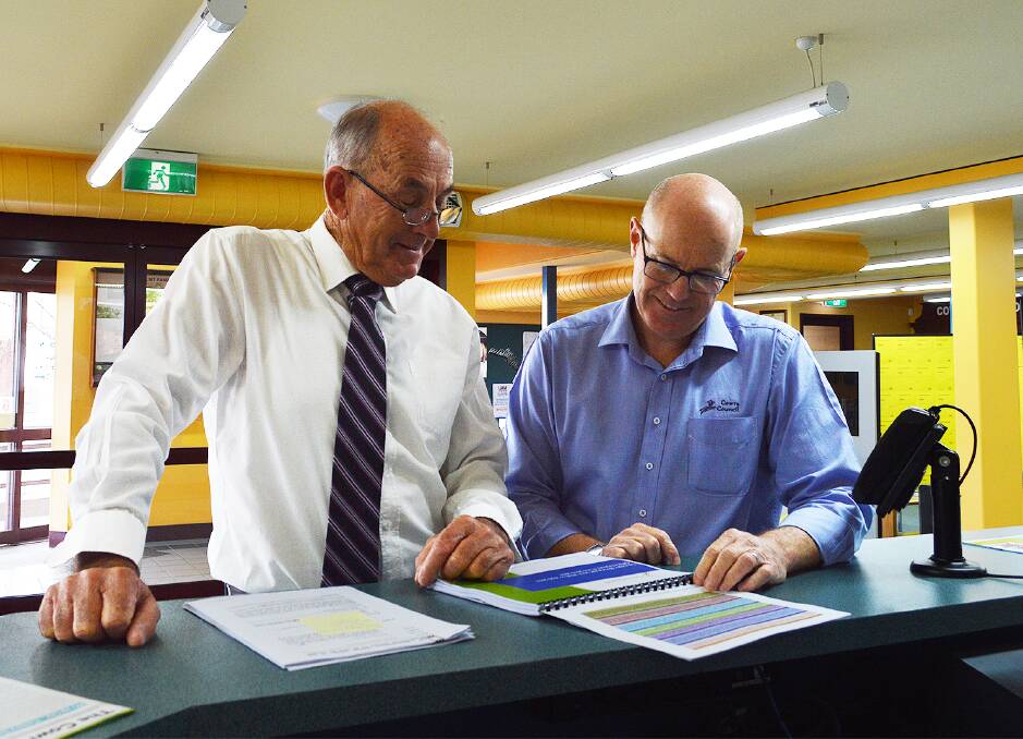 Mayor of Cowra, Cr Bill West and General Manager, Paul Devery view Councils Draft Operational Plan which is now on public display in Councils foyer.